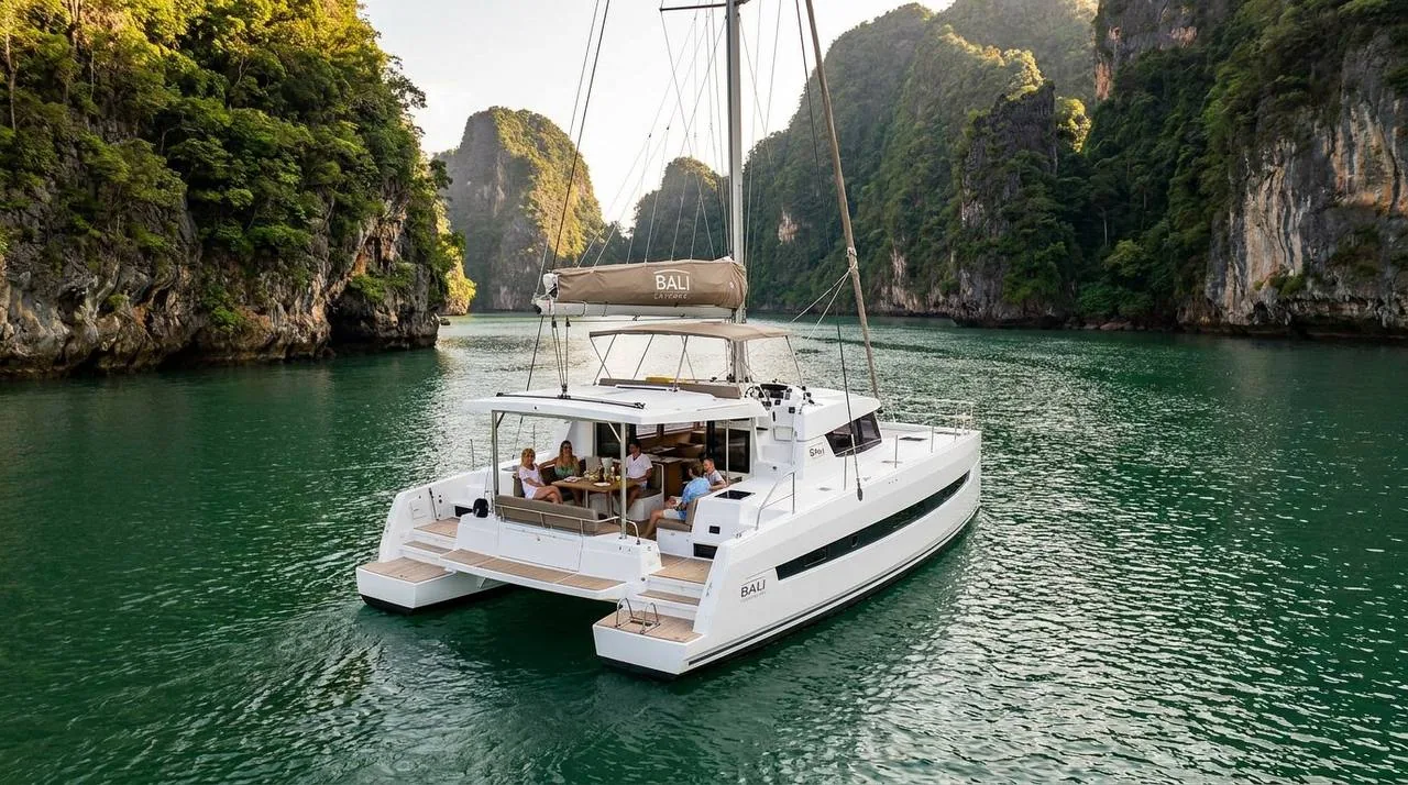 Bali Catspace Siva at anchor in a hidden lagoon surrounded by limestone cliffs in Phang Nga Bay