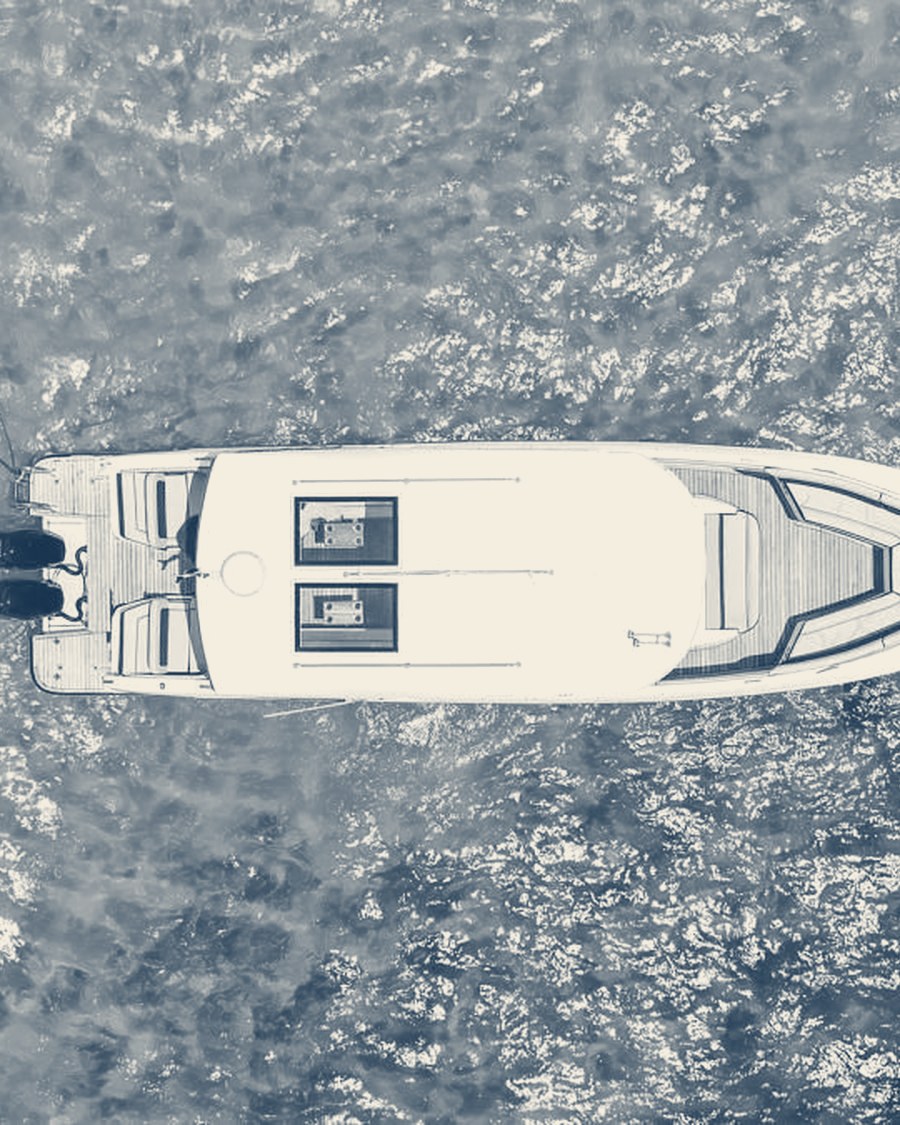 Aerial view of a yacht on turquoise water